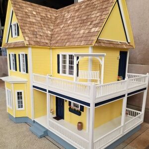 Charming Yellow Dollhouse with Porch